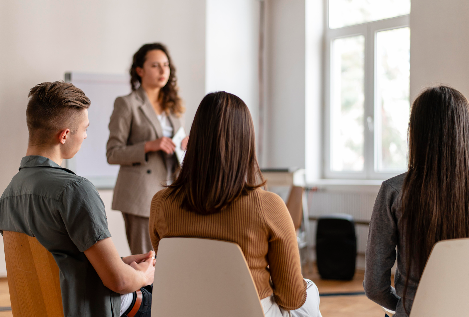 woman talking to a group of people