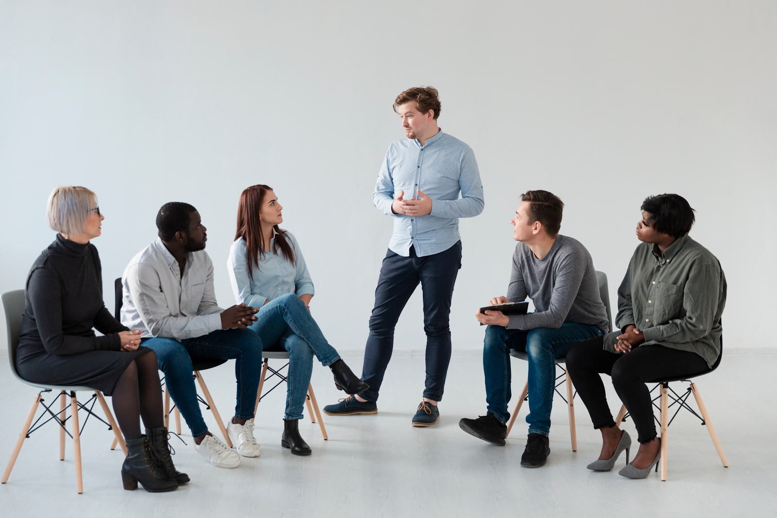 man talking to a group of people