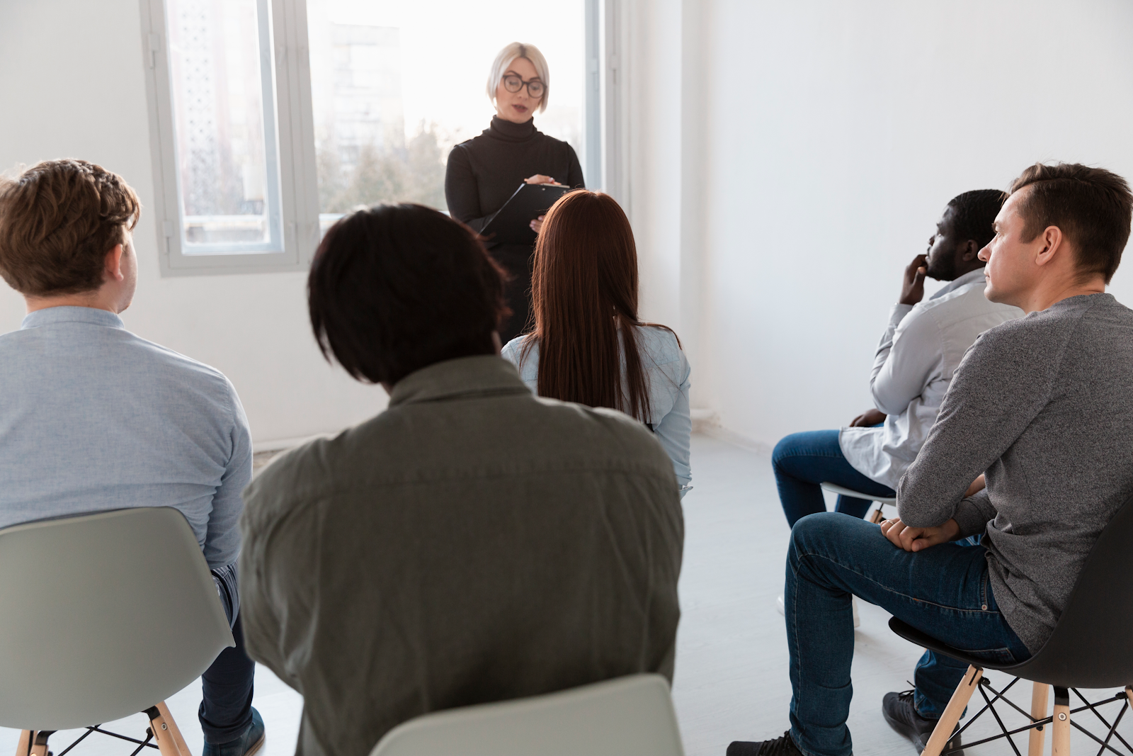 woman talking to a group of people