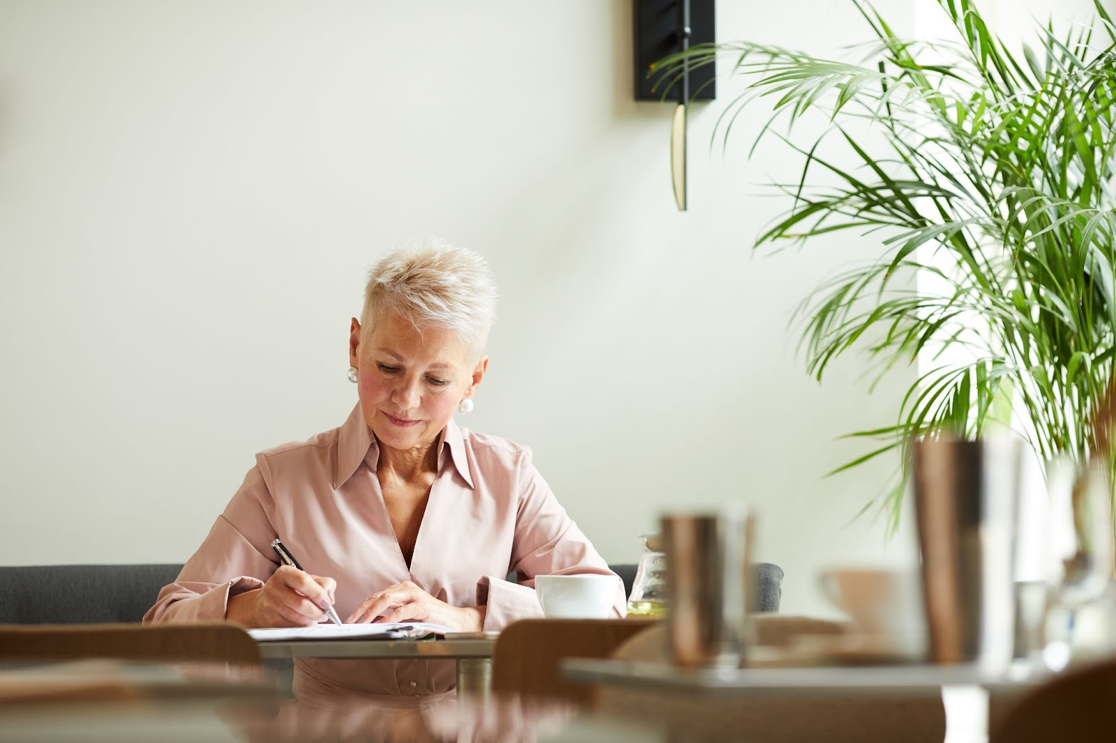 a life coach writing in a notebook