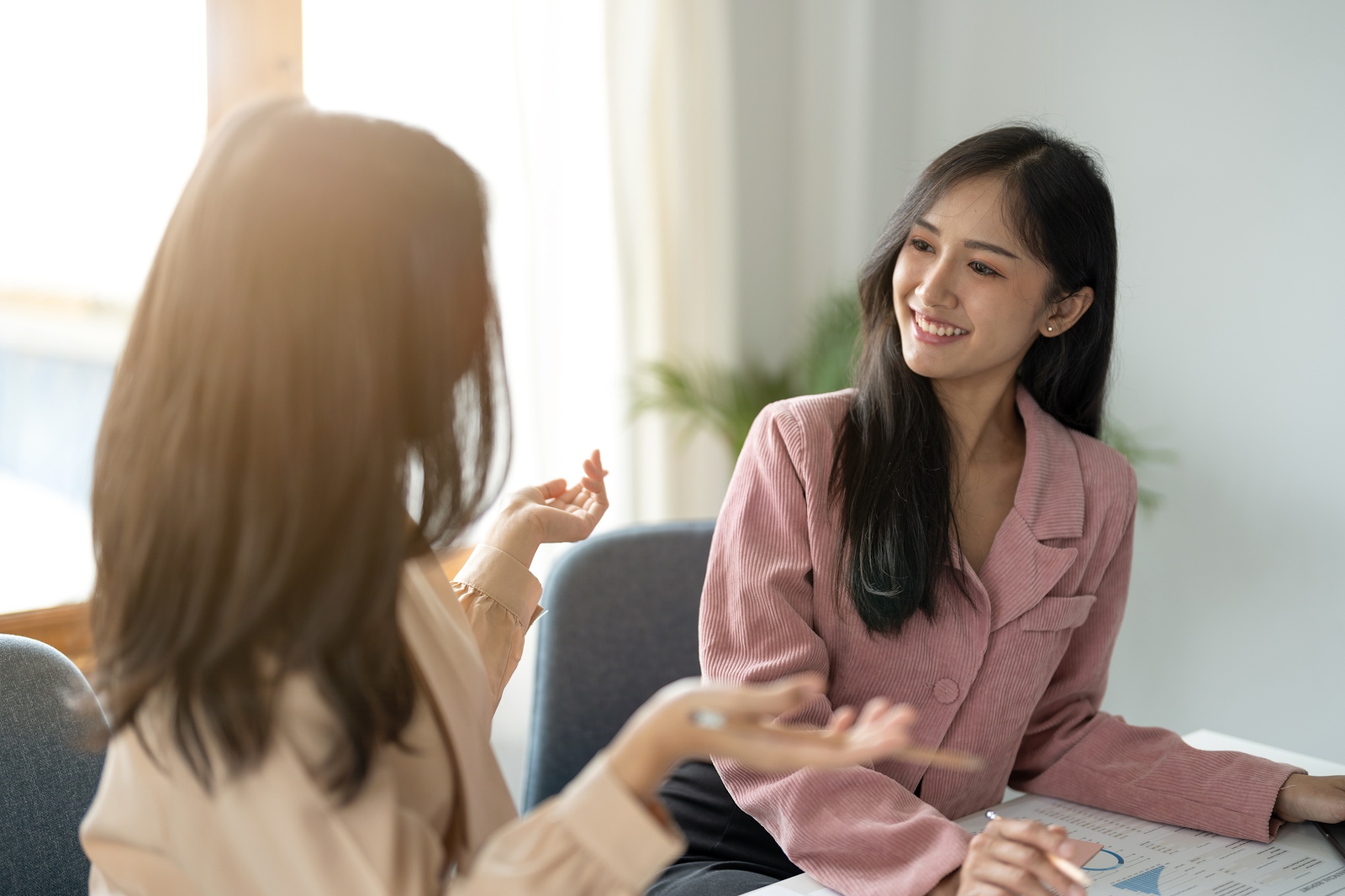 women talking in an office