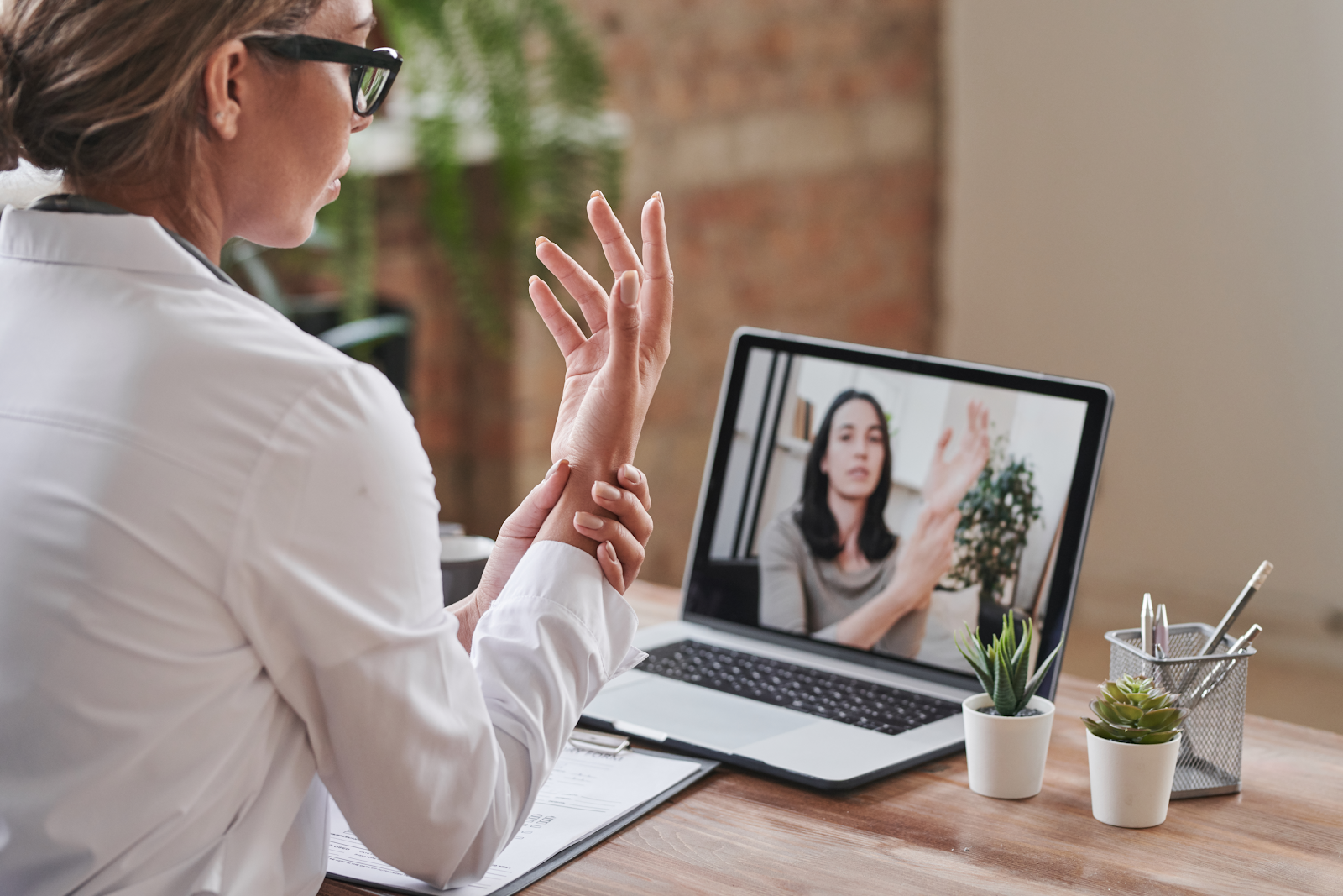 woman watching an online program on her laptop